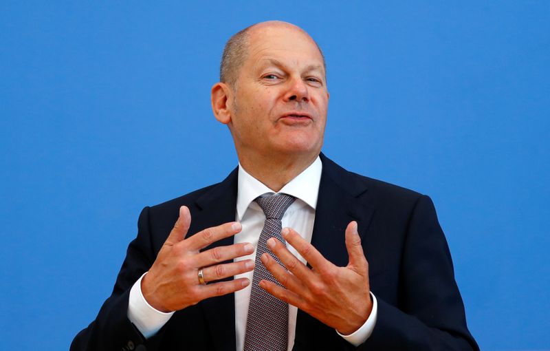 FILE PHOTO: German Finance Minister Olaf Scholz presents the federal