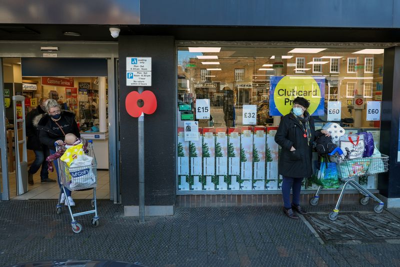 People stock up with items from a Tesco supermarket in