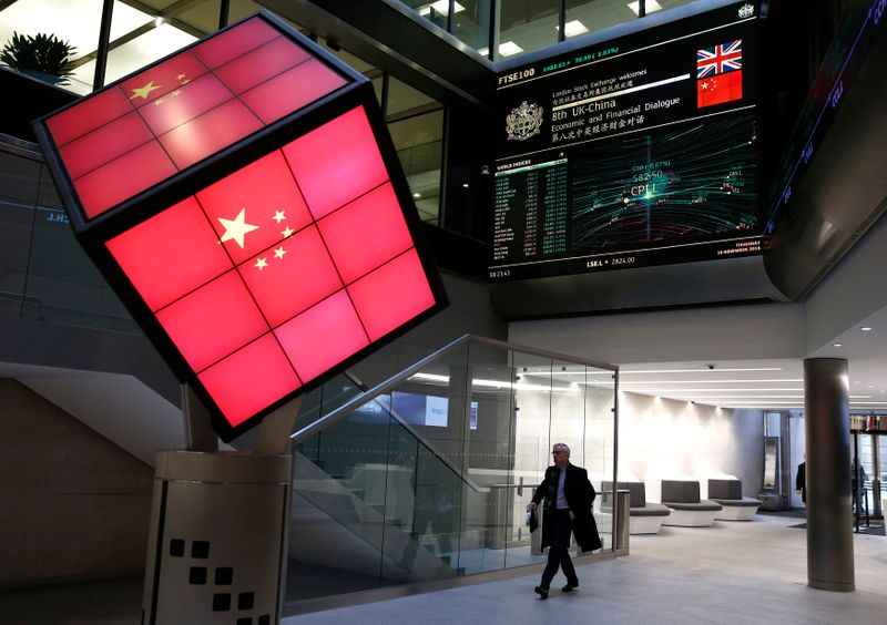 FILE PHOTO: An illuminated cube bearing the Chinese flag is