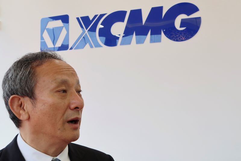 Wang Min, chairman of XCMG Construction Machinery, speaks during an