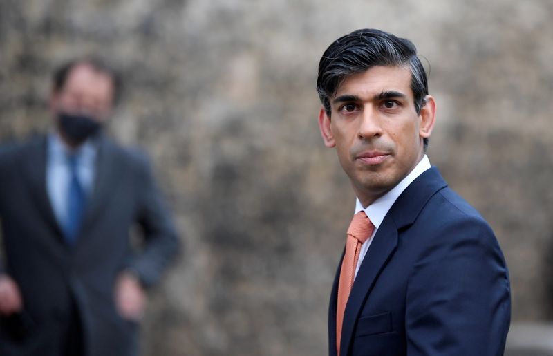 Britain’s Chancellor of the Exchequer Rishi Sunak looks on as
