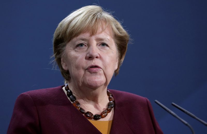 FILE PHOTO: German Chancellor Angela Merkel addresses the media in