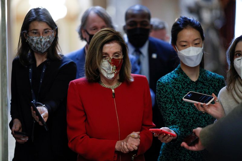 FILE PHOTO: Speaker of the House Pelosi speaks to reporters
