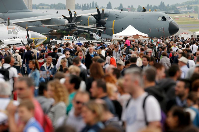 FILE PHOTO: Visitors walk at the static display area during