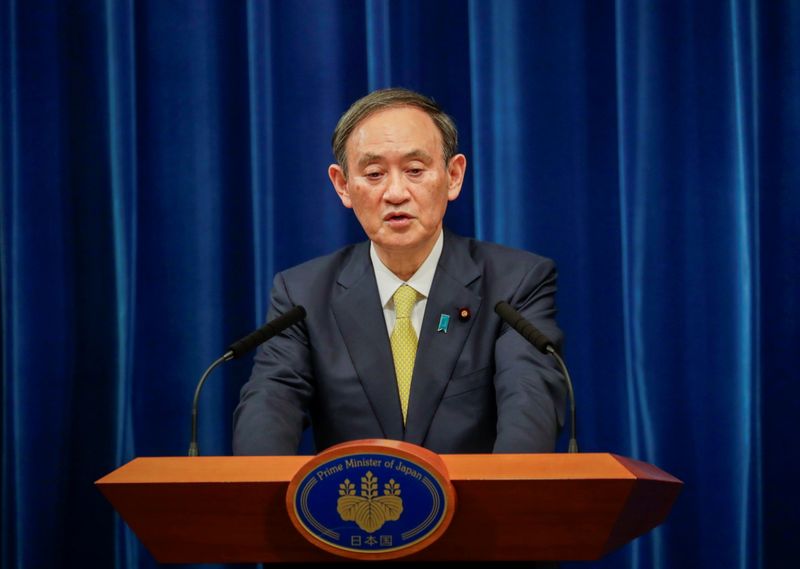 Japanese Prime Minister Yoshihide Suga speaks during a news conference