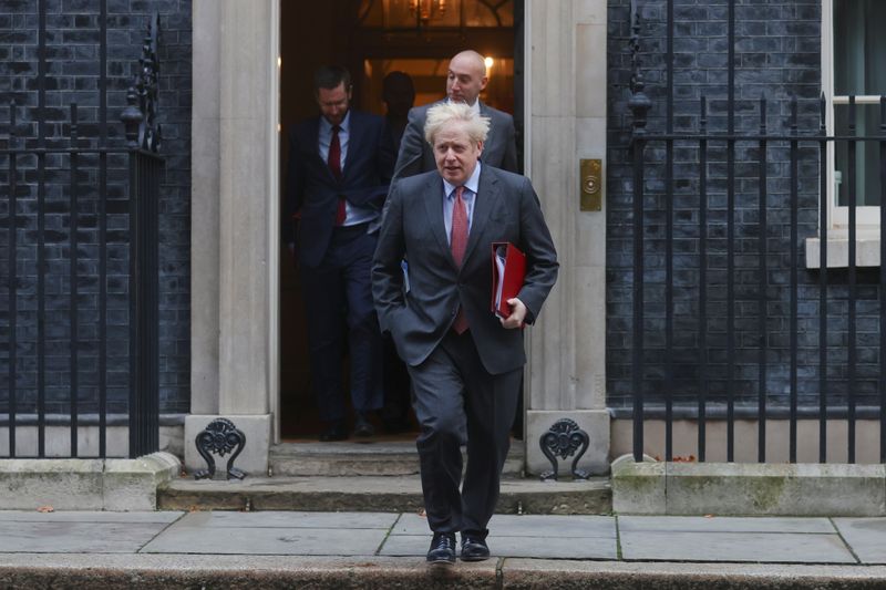 Britain’s Prime Minister Boris Johnson walks outside Downing Street, in