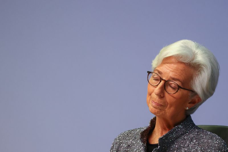 European Central Bank (ECB) President Christine Lagarde reacts as she
