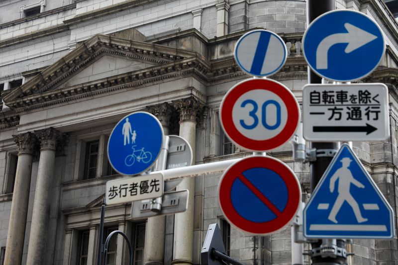 FILE PHOTO:  Traffic signs are seen in front of