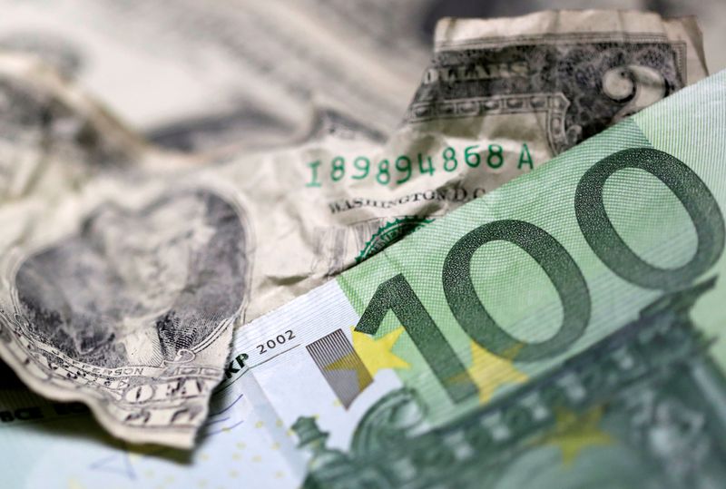 FILE PHOTO: U.S. dollar and Euro banknotes are seen in