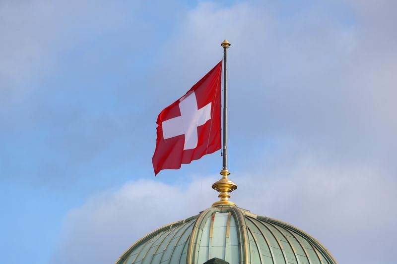 The flag of Switzerland flies on the dome of the