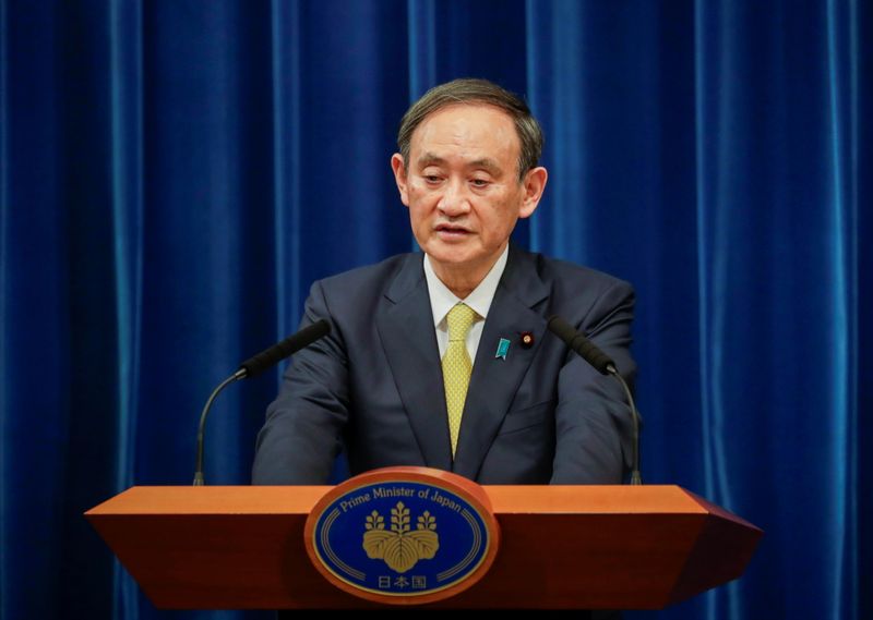 FILE PHOTO:  Japanese Prime Minister Yoshihide Suga speaks during