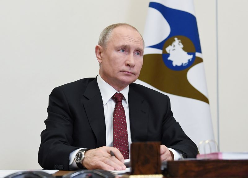 Russian President Putin attends a meeting of the Supreme Eurasian
