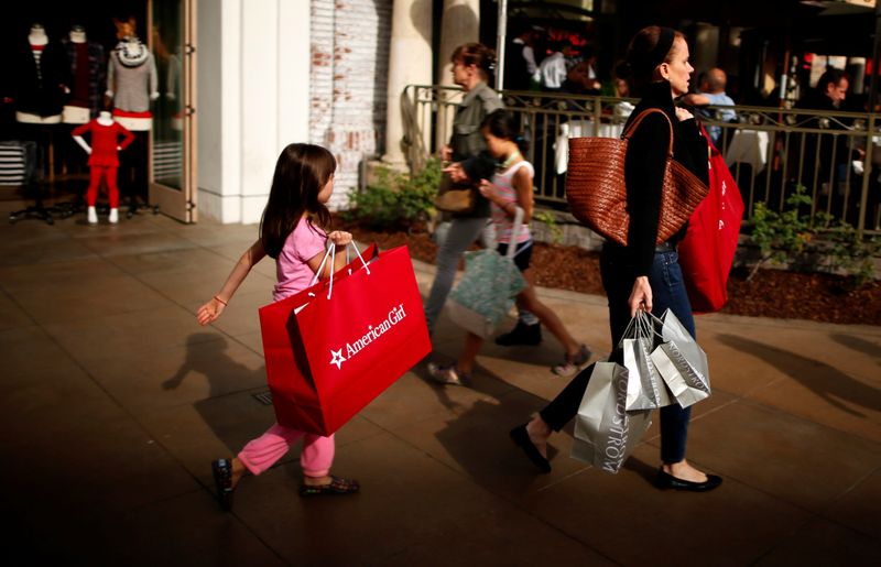 People shop at The Grove mall in Los Angeles