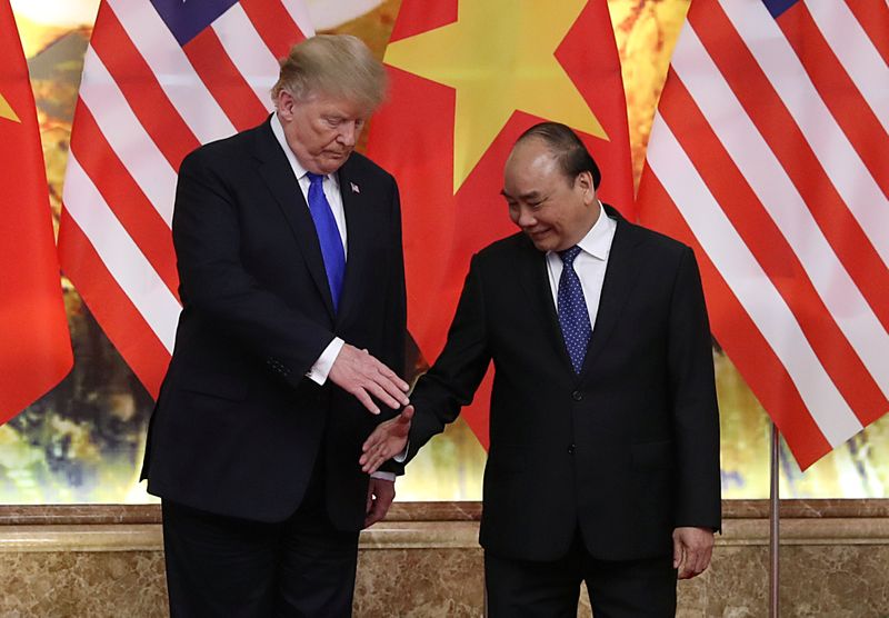 U.S. President Trump shakes hands with Vietnamese Prime Minister Nguyen
