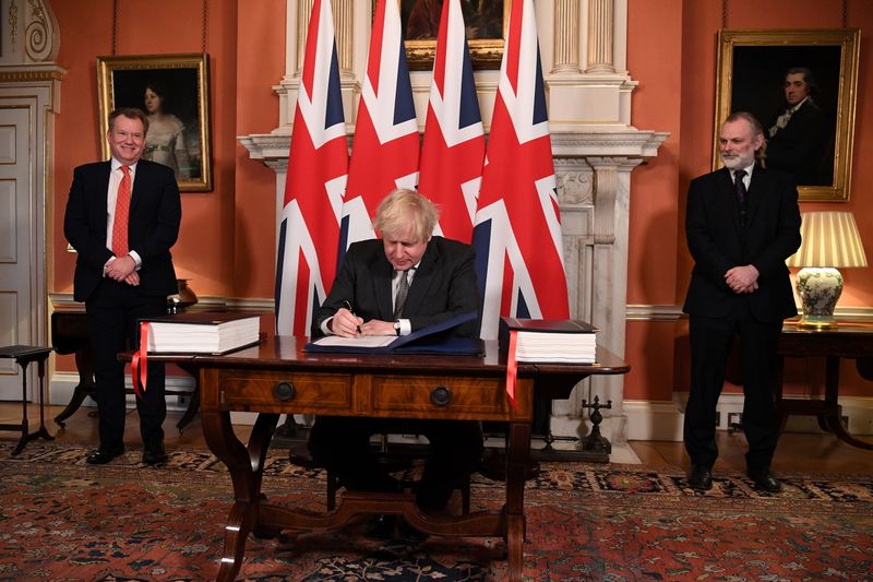 Britain’s Prime Minister Boris Johnson signs the Brexit trade deal