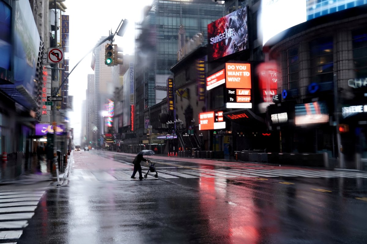 Person with a walker crosses 42nd Street in Manhattan
