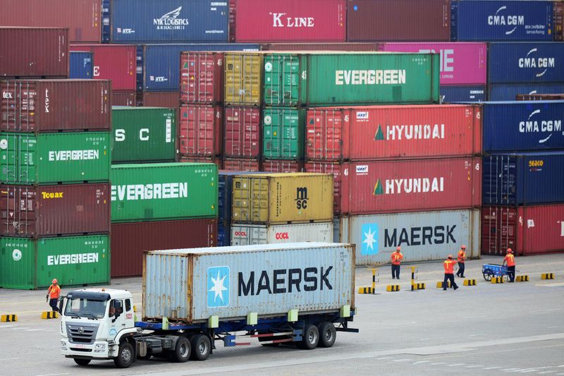 FILE PHOTO:  Truck transports a container at a port
