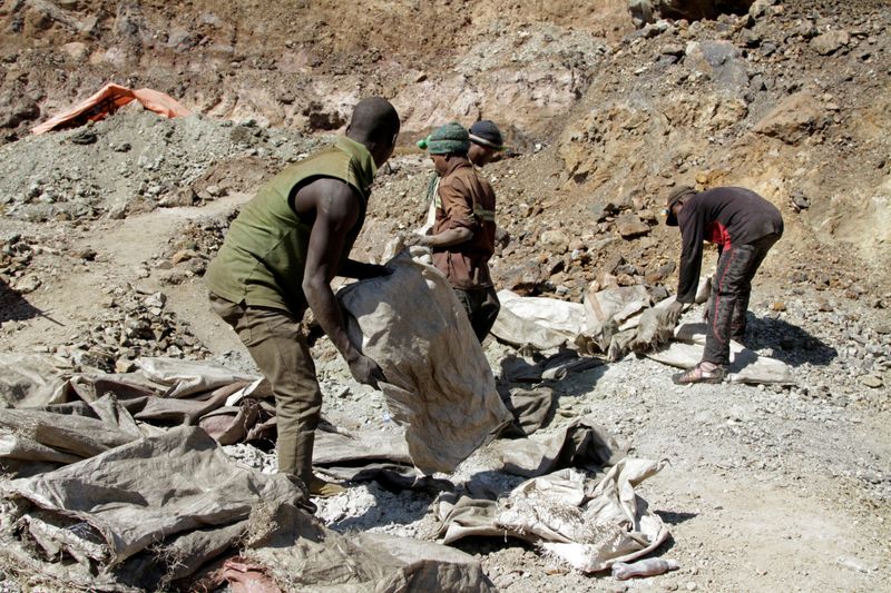 FILE PHOTO: Artisanal miners work at the Tilwizembe outside of