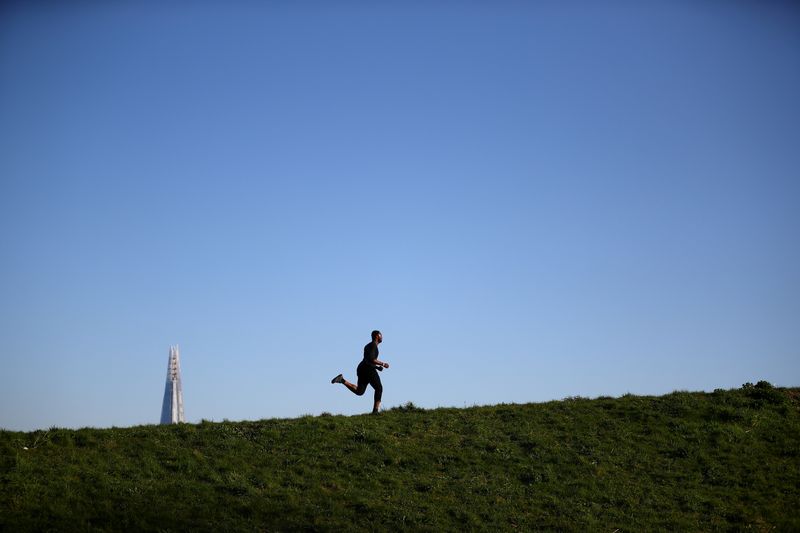 A runner is seen in Burgess Park, as the spread