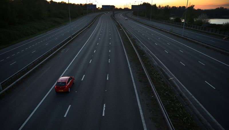 A car travels along a deserted stretch of the M60