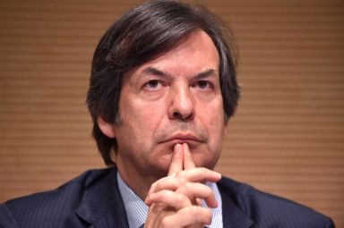 Messina, CEO of Intesa Sanpaolo bank looks on during shareholders