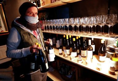 Werner Frisch of Alto Adige restaurant wine bar carries bottles