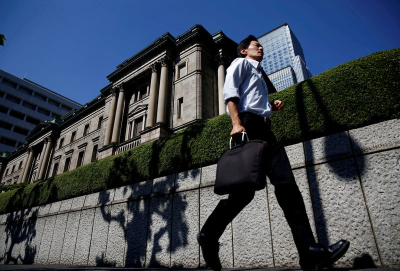 A man runs past the Bank of Japan building in