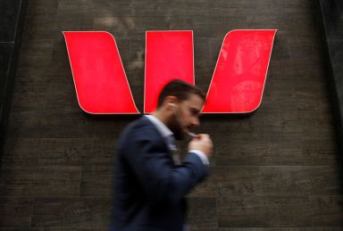 A man walks past a Westpac bank branch in Sydney,