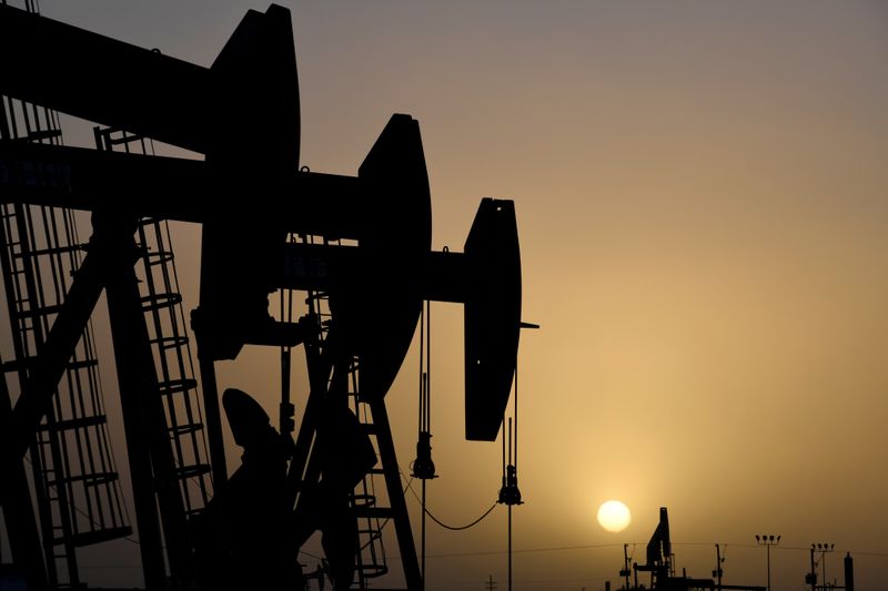 FILE PHOTO: FILE PHOTO: Pump jacks operate at sunset in