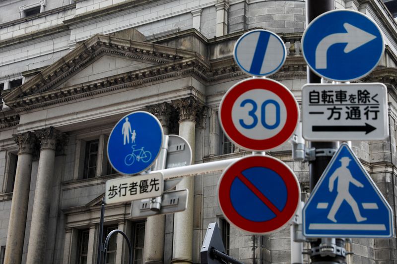 FILE PHOTO: Traffic signs are seen in front of the