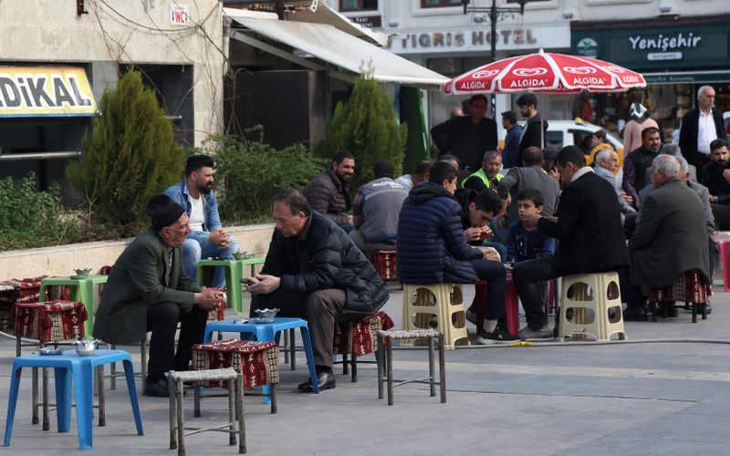 People sit at an open-air cafe in Diyarbakir