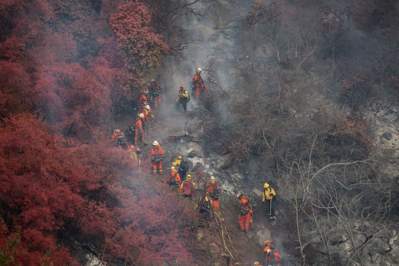 FILE PHOTO: A wildfire dubbed the Cave Fire burns in