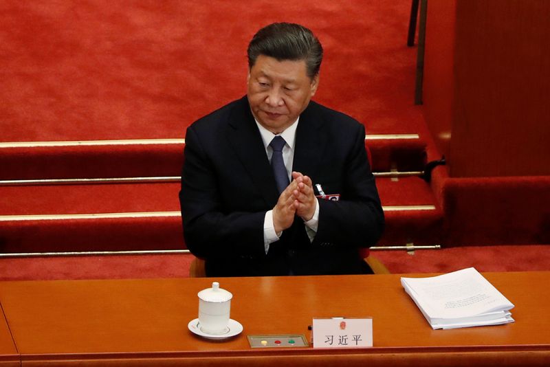 Chinese President Xi Jinping attends the opening session of NPC