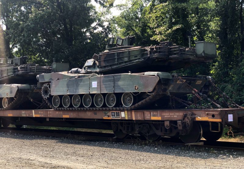 FILE PHOTO: An M1 Abrams tank sits atop a flat