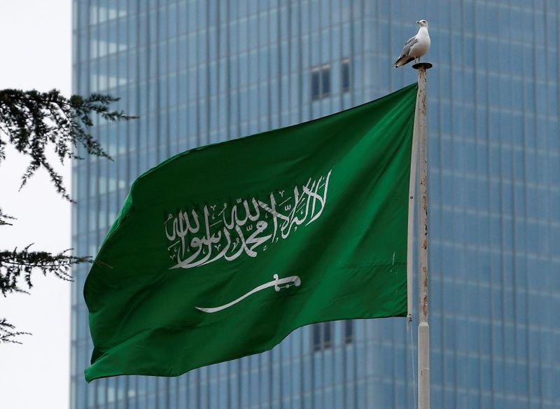 A Saudi flag flutters atop Saudi Arabia’s consulate in Istanbul