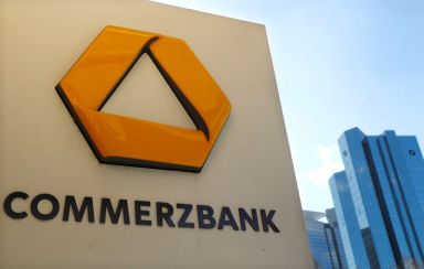 A sign for an ATM of Commerzbank is seen next