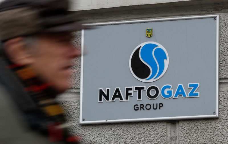 A man walks past Naftogaz headquarters in Kiev