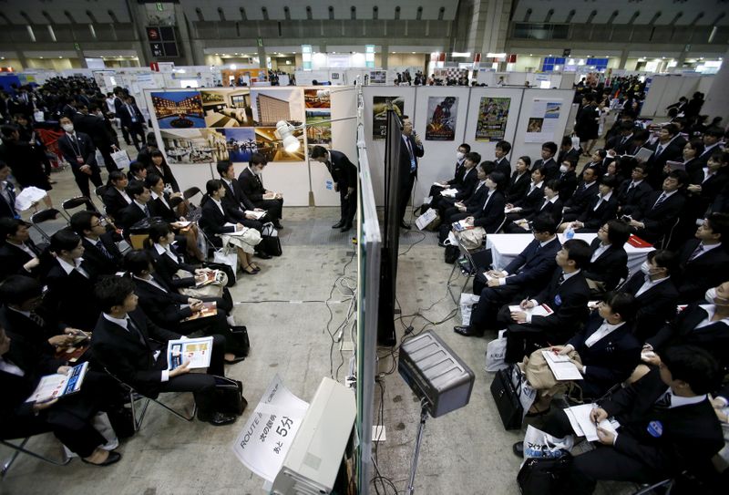 FILE PHOTO: Job seekers attend orientation sessions at company booths