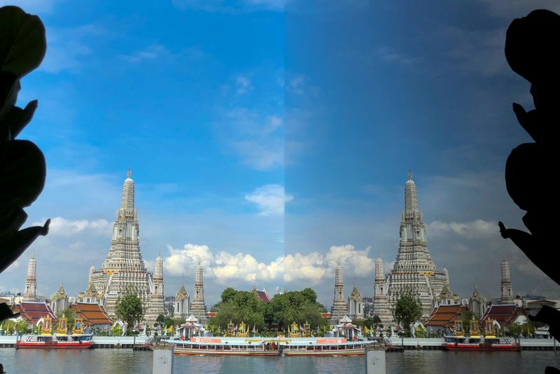 FILE PHOTO: Wat Arun temple and its reflection are seen
