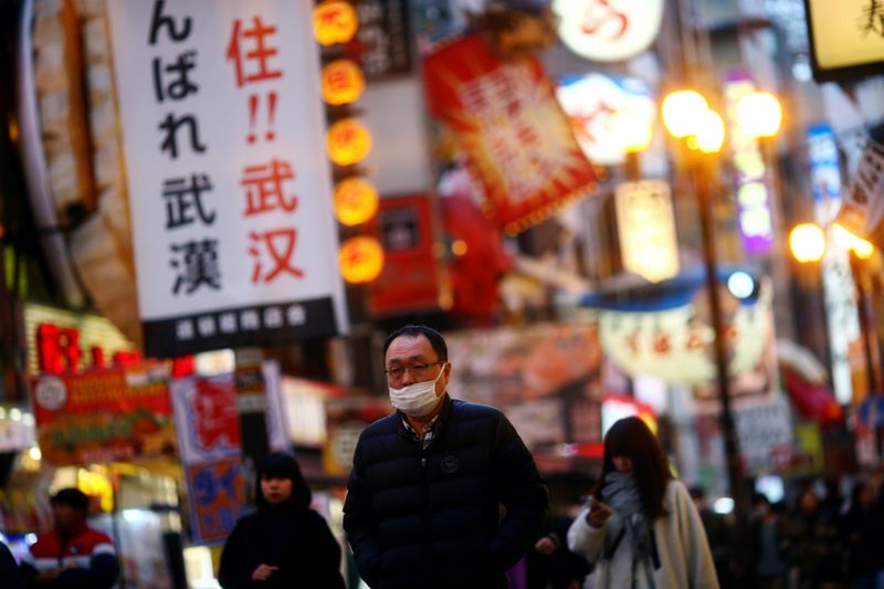 A man, wearing protective mask following an outbreak of the