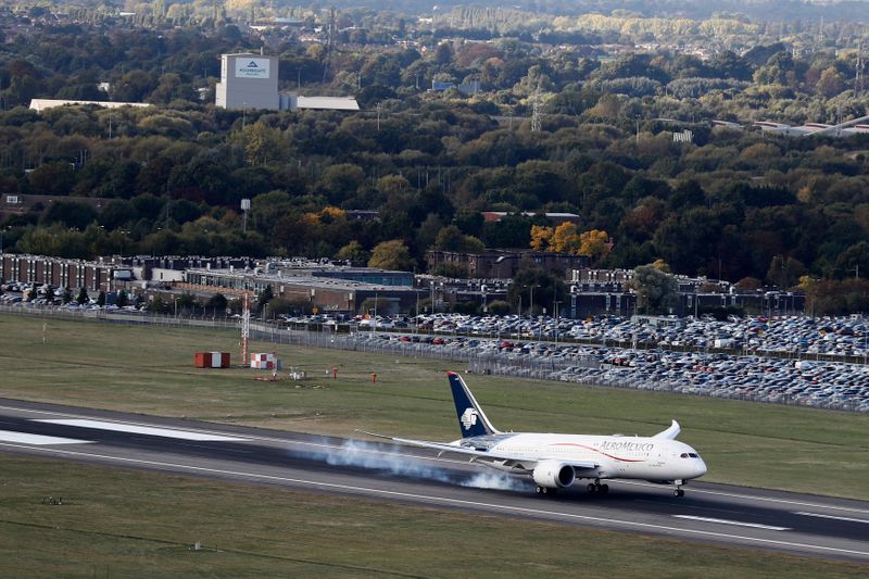 An aircrafts lands at the north runaway at Heathrow Airport