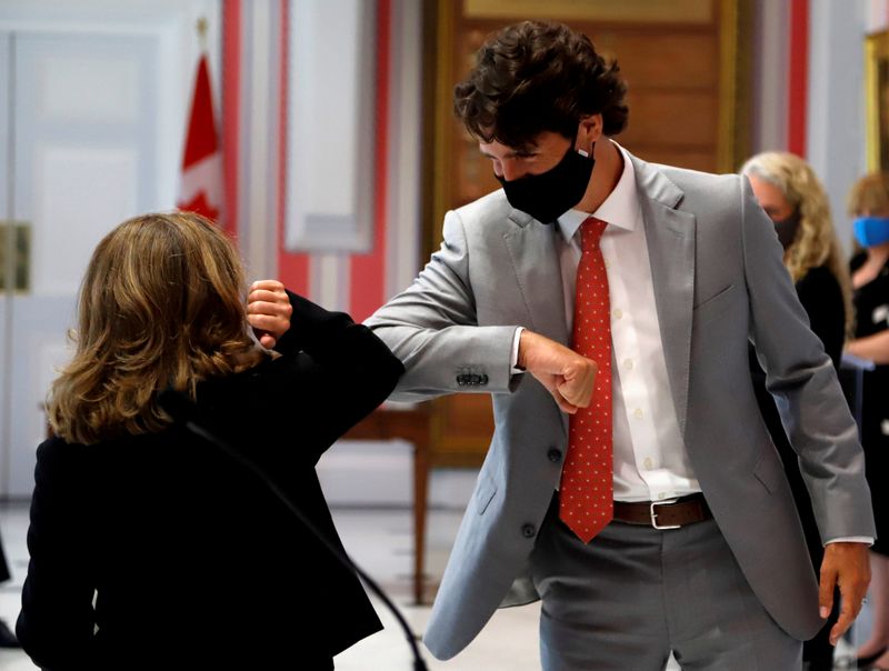 Freeland elbow bumps Canadian PM Trudeau after she is sworn