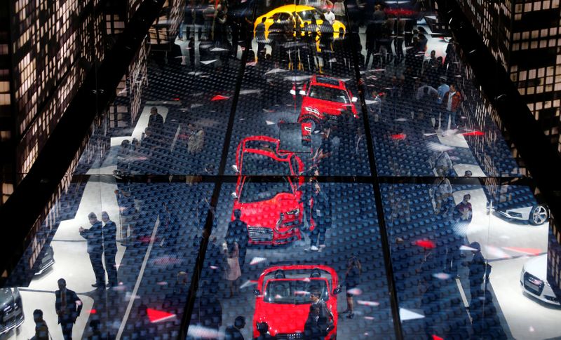 The stand of German car manufacturer Audi is reflected in