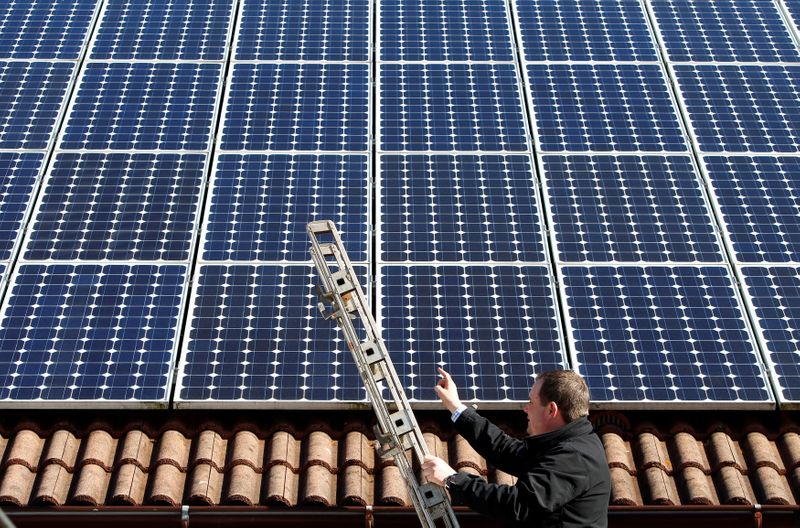 FILE PHOTO: Michael Greif controls his 56 photovoltaic (solar) panels