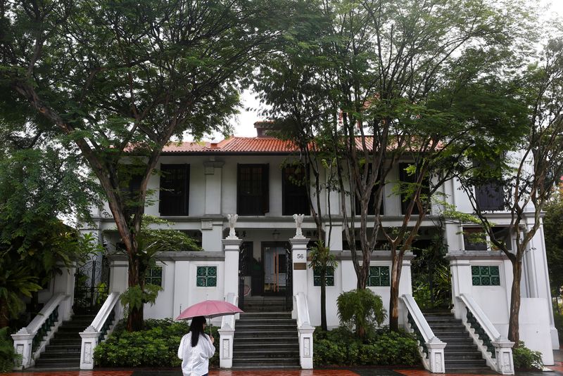A woman passes the Wilmar headquarters in Singapore