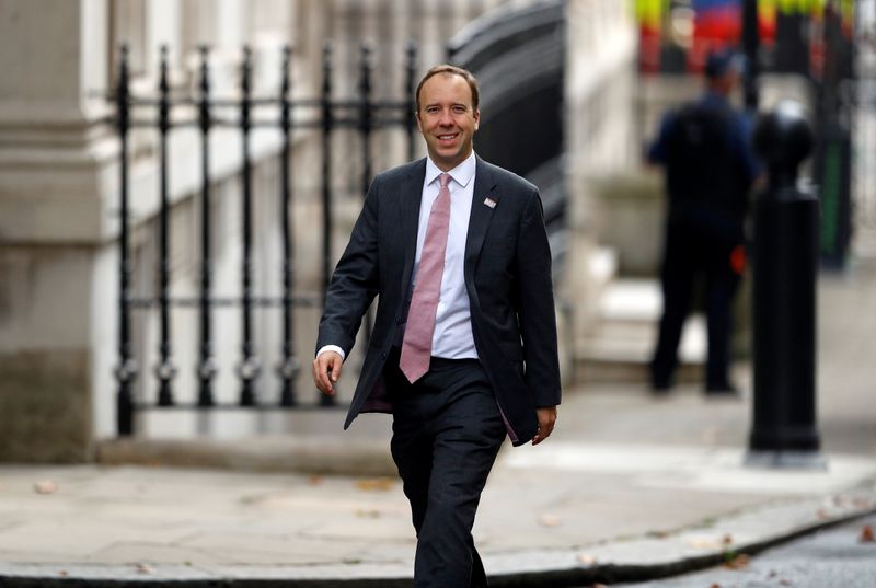 Britain’s Health Secretary Matt Hancock walks outside Downing Street in