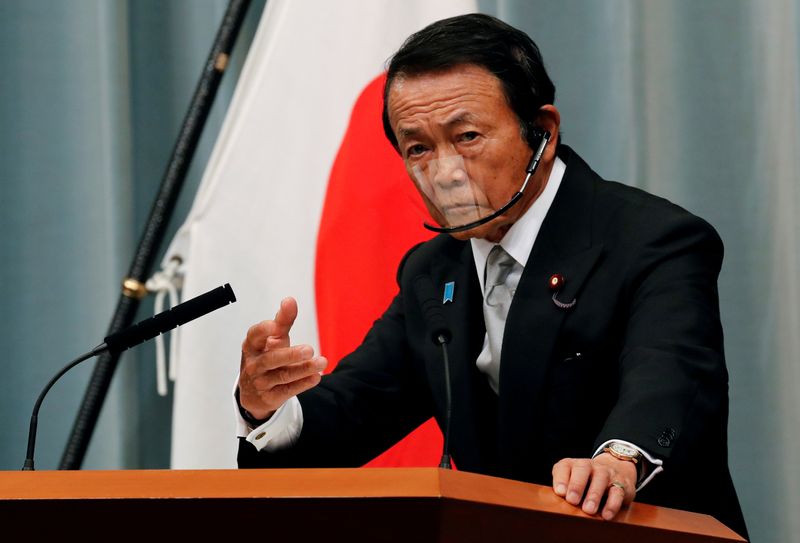 FILE PHOTO: Japan’s newly-appointed Finance Minister Taro Aso speaks at