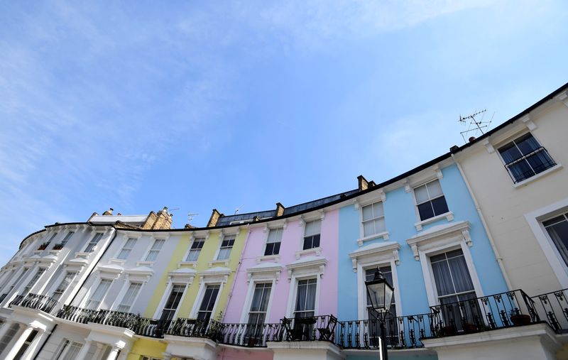 Houses are seen painted in various colours in a residential