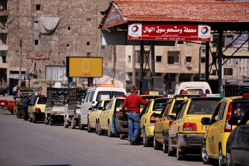 Cars queue at gasoline station in Aleppo