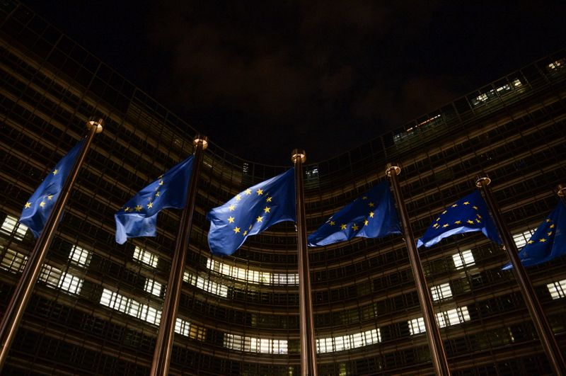 European Union flags flutter in front of the European Commission